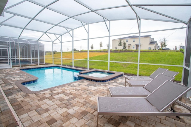 view of swimming pool with a lanai, a patio area, a pool with connected hot tub, and a lawn