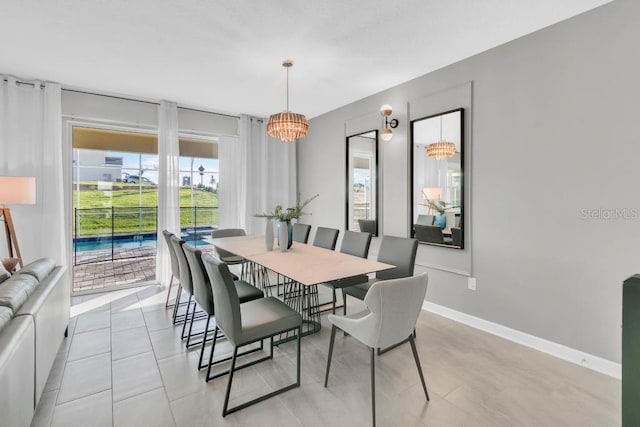 dining room featuring baseboards