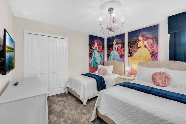 carpeted bedroom featuring a closet and a notable chandelier