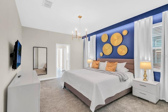 bedroom with light carpet, an inviting chandelier, baseboards, and visible vents