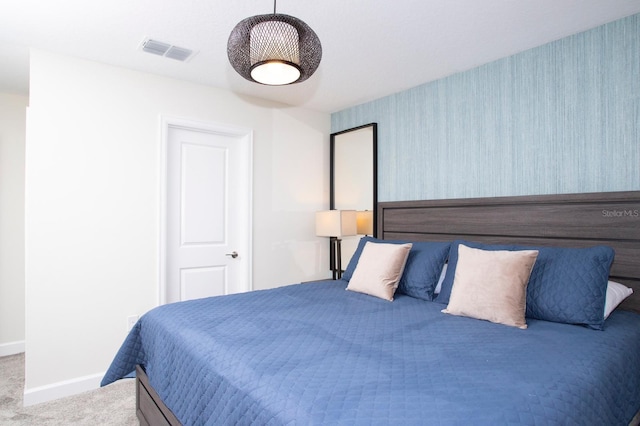 bedroom with wallpapered walls, baseboards, visible vents, and carpet flooring