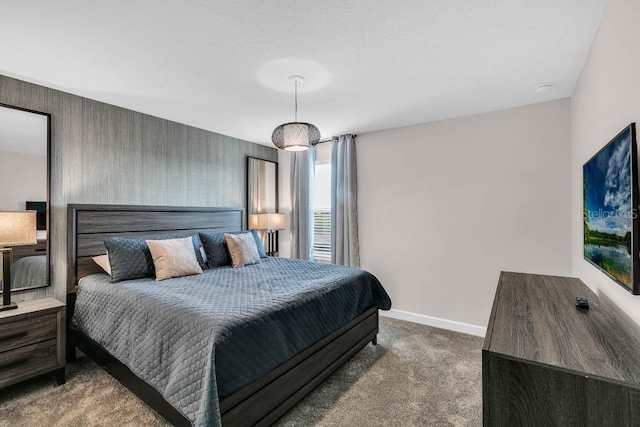 bedroom featuring carpet flooring and baseboards