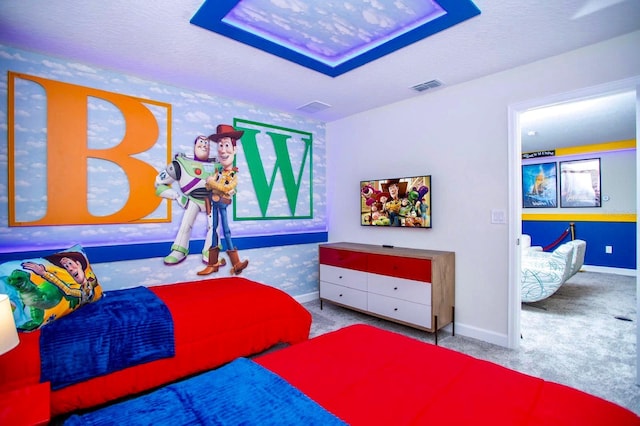 bedroom featuring carpet floors, baseboards, visible vents, and a textured ceiling