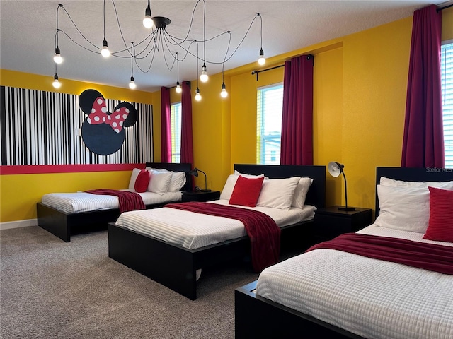 bedroom featuring carpet floors and baseboards