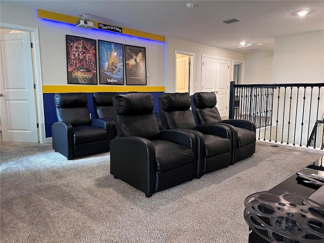 carpeted home theater featuring visible vents