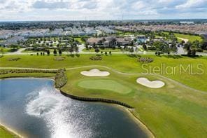 aerial view with a water view and golf course view