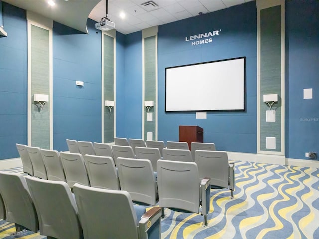 cinema with visible vents, a drop ceiling, and baseboards