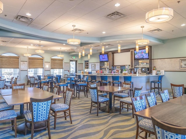 dining area featuring carpet and visible vents