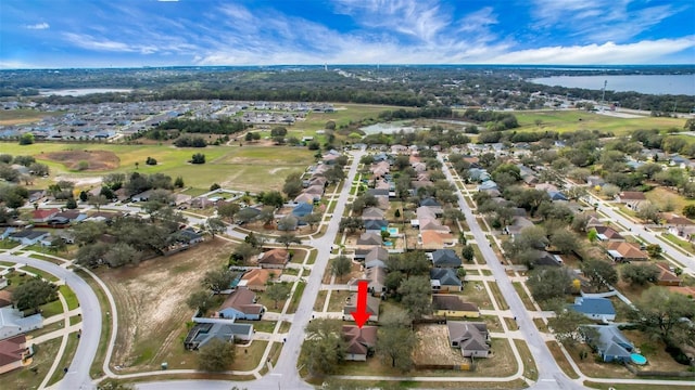 bird's eye view with a water view and a residential view