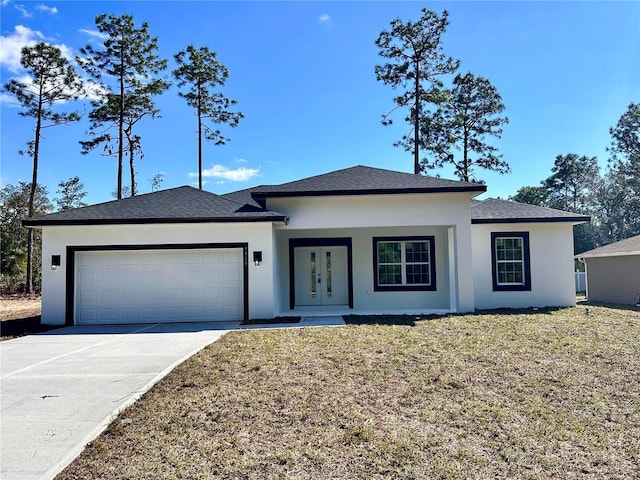 view of front of property featuring driveway, a front yard, an attached garage, and stucco siding