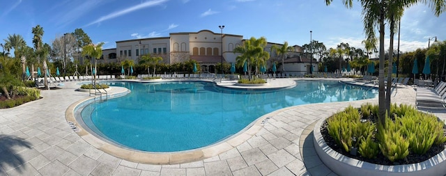 community pool with a patio area