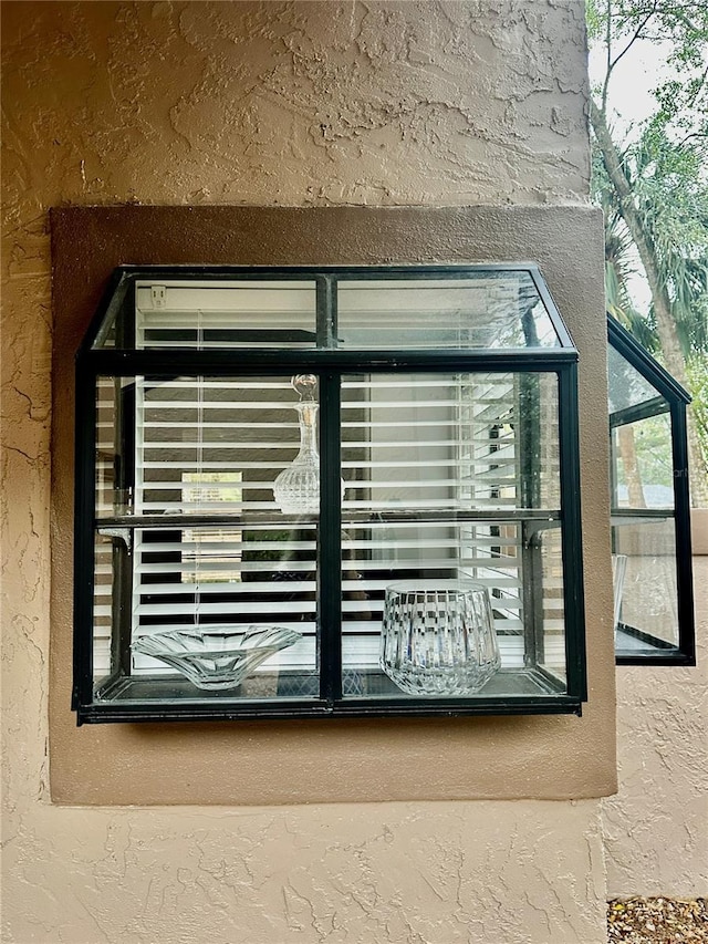 exterior details featuring stucco siding