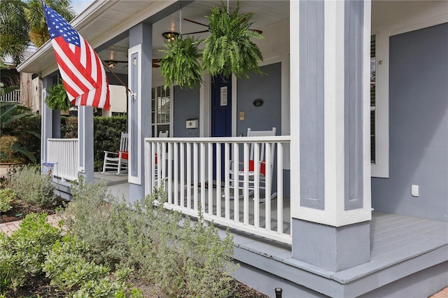 view of exterior entry featuring covered porch