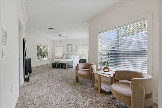 bedroom with light colored carpet, visible vents, ornamental molding, ceiling fan, and baseboards