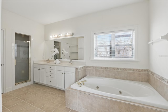 full bathroom featuring double vanity, a stall shower, a tub with jets, and a sink