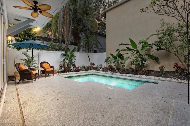 view of pool with a patio area, a fenced backyard, a fenced in pool, and a ceiling fan