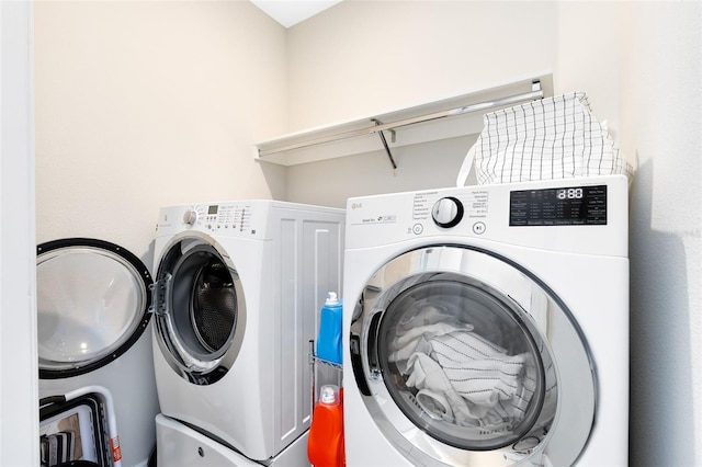 laundry area featuring laundry area and washer and clothes dryer