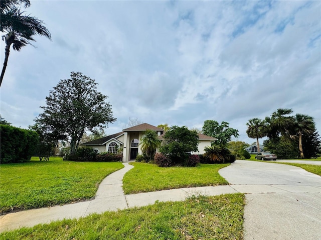 view of front of property with driveway and a front yard