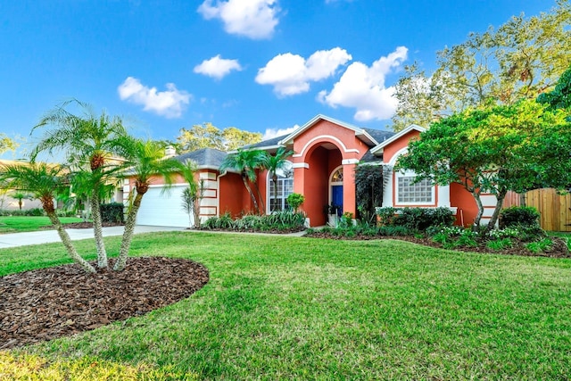 single story home with fence, concrete driveway, a front yard, stucco siding, and an attached garage