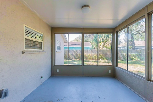 unfurnished sunroom with a healthy amount of sunlight