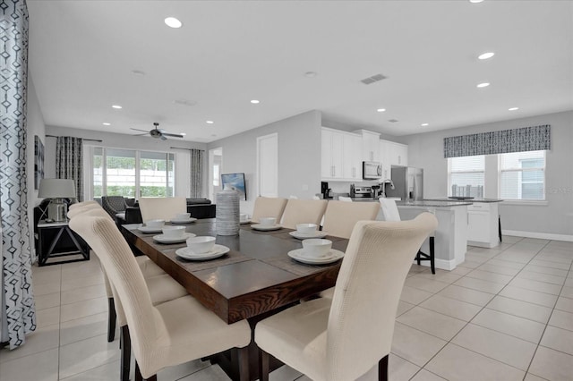 dining space featuring light tile patterned floors, baseboards, visible vents, ceiling fan, and recessed lighting