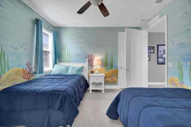 bedroom with baseboards, a textured ceiling, a ceiling fan, and carpet flooring