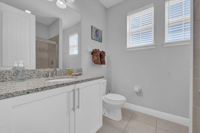 bathroom with baseboards, a healthy amount of sunlight, a stall shower, and tile patterned floors