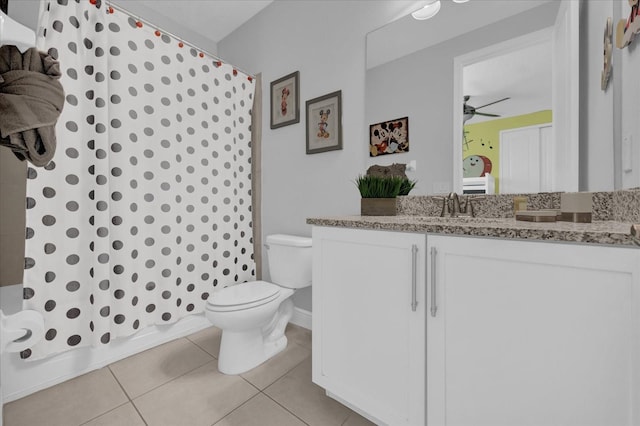 full bathroom with shower / bath combination with curtain, toilet, ceiling fan, vanity, and tile patterned flooring