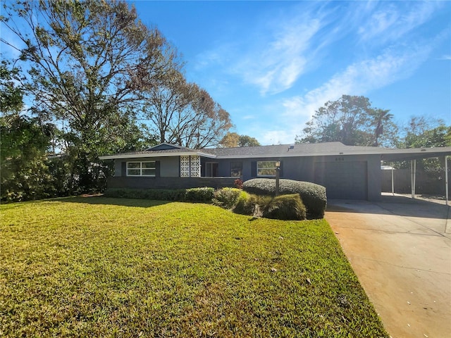 single story home with a carport, concrete driveway, a front lawn, and stucco siding