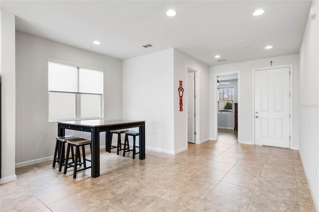 dining space with light tile patterned floors, baseboards, visible vents, and recessed lighting