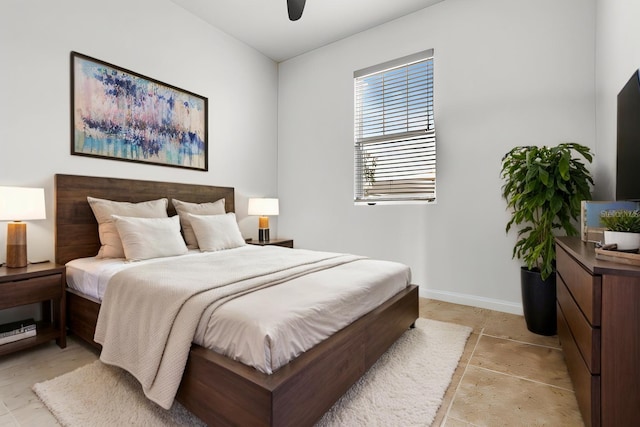 bedroom featuring ceiling fan and baseboards