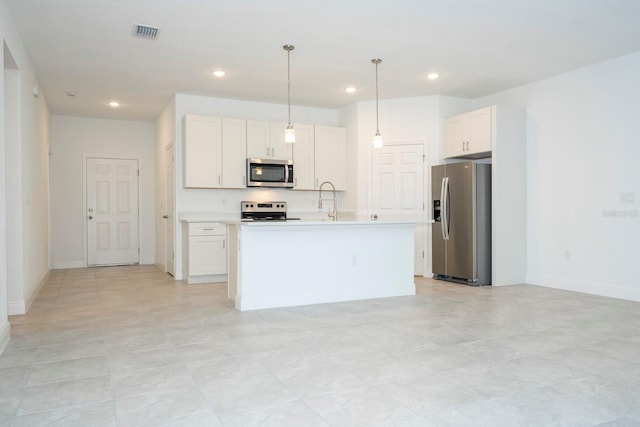 kitchen featuring white cabinetry, a center island with sink, appliances with stainless steel finishes, and hanging light fixtures