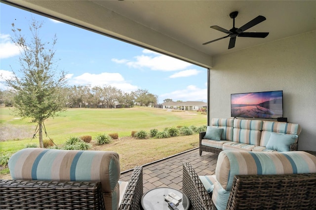 view of patio featuring a ceiling fan and outdoor lounge area