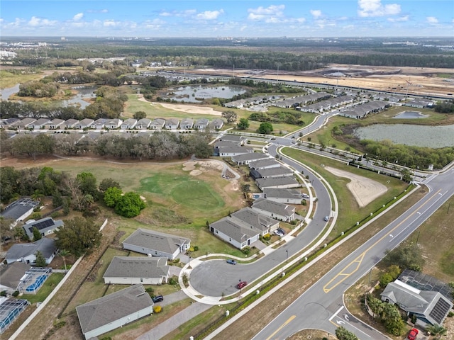 birds eye view of property with a residential view and a water view