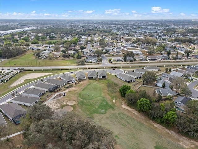 drone / aerial view featuring a residential view and view of golf course