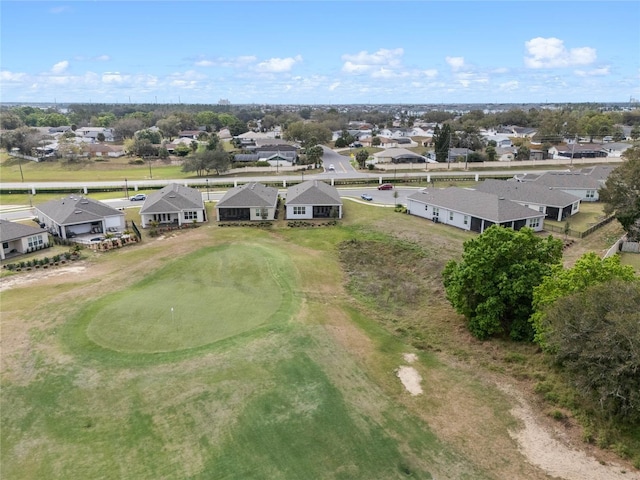 birds eye view of property with a residential view and view of golf course