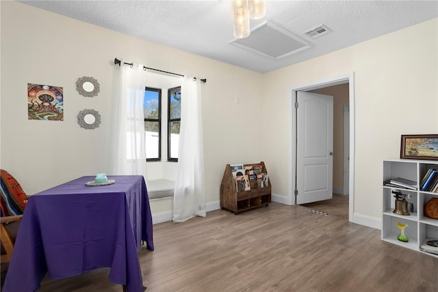 2531 Ludlow St, Deltona, FL 32738 - interior space featuring a textured ceiling, wood finished floors, attic access, and visible vents
