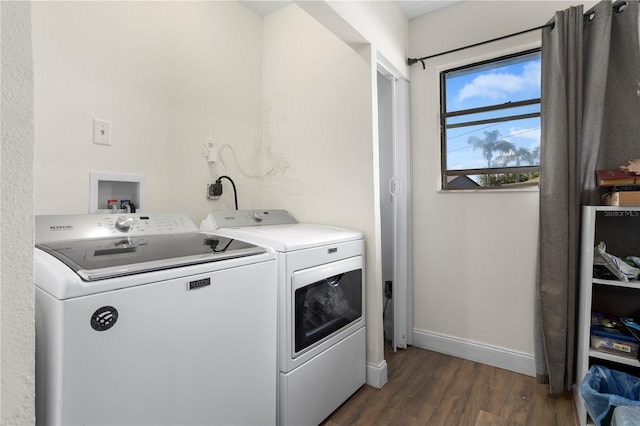 2531 Ludlow St, Deltona, FL 32738 - laundry room featuring washing machine and dryer, dark wood-style flooring, baseboards, and laundry area