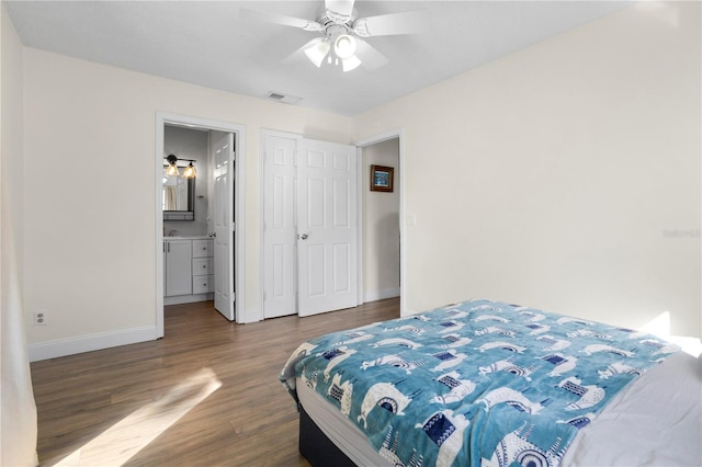 2531 Ludlow St, Deltona, FL 32738 - bedroom featuring baseboards, connected bathroom, visible vents, ceiling fan, and wood finished floors