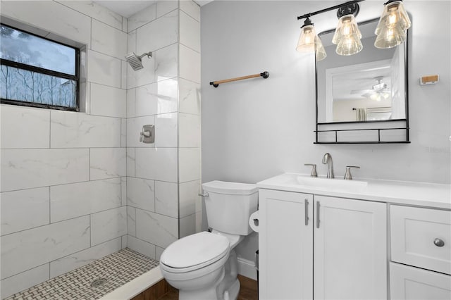 2531 Ludlow St, Deltona, FL 32738 - full bathroom with toilet, tiled shower, vanity, and a ceiling fan