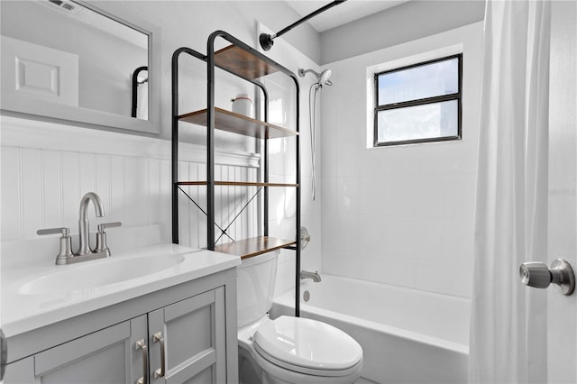 2531 Ludlow St, Deltona, FL 32738 - bathroom featuring toilet, a wainscoted wall, vanity, and shower / bath combination with curtain