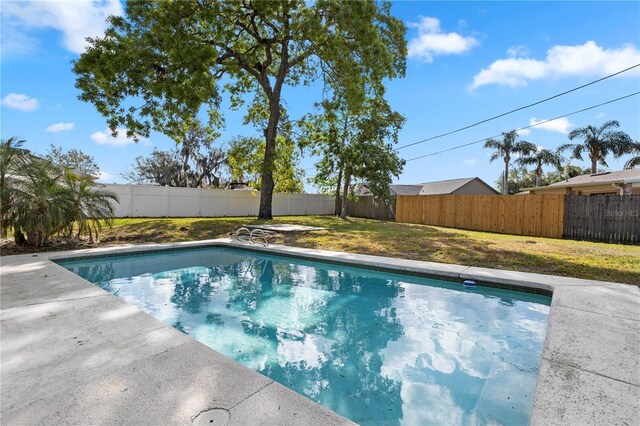 2531 Ludlow St, Deltona, FL 32738 - view of pool with a fenced in pool, a fenced backyard, and a lawn