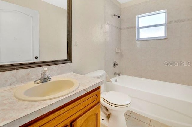 full bath featuring vanity, toilet, tile patterned floors, and shower / bathing tub combination