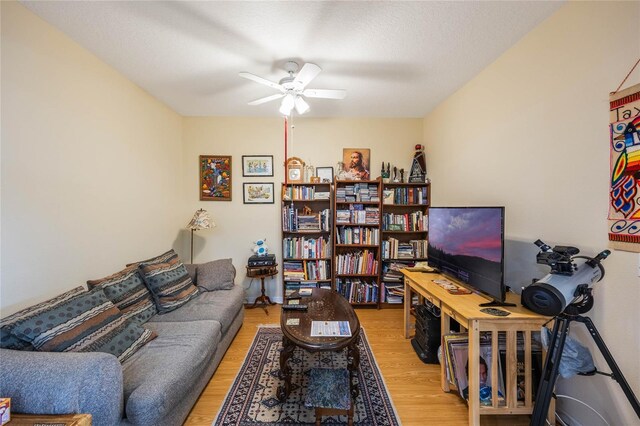 3632 Solana Cir Unit B, Clermont, FL 34711 - living area featuring a ceiling fan and wood finished floors