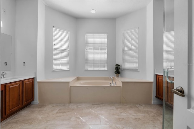 full bath featuring a bath and vanity