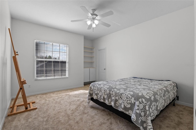 bedroom with baseboards, carpet floors, and a ceiling fan