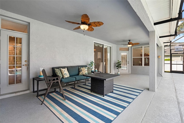 view of patio featuring an outdoor living space and ceiling fan