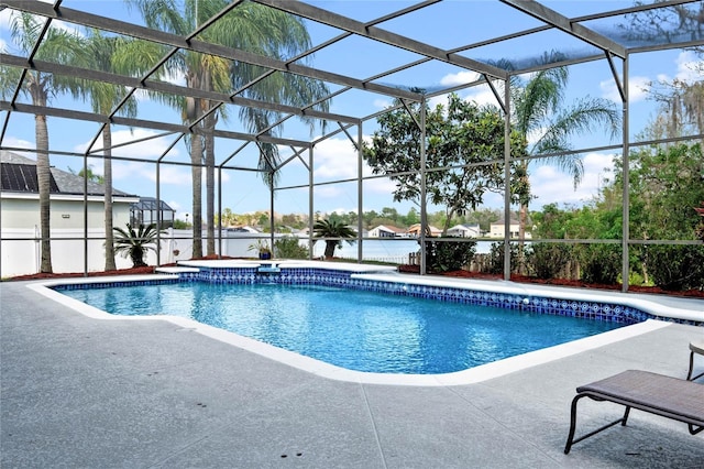 outdoor pool with glass enclosure and a patio area