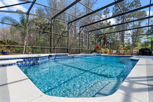 outdoor pool with a lanai and a patio