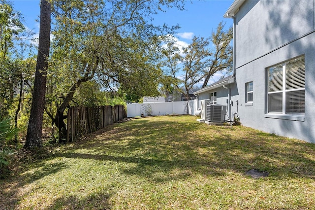 view of yard featuring cooling unit and a fenced backyard